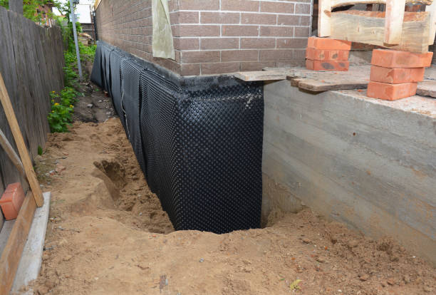 Happy homeowners after waterproofing job in Caledonia